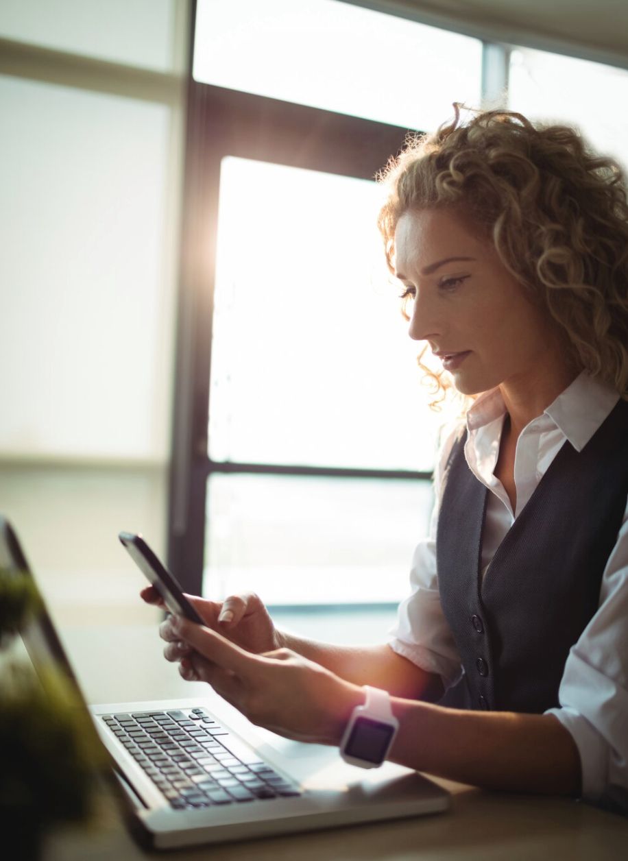 woman using her mobile phone to check her account activity