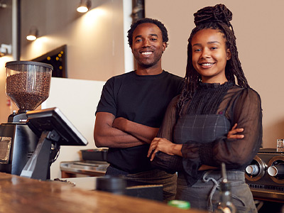 coffee shop owners waiting to serve customers at the counter
