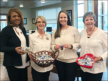 staff handing out treats to customers