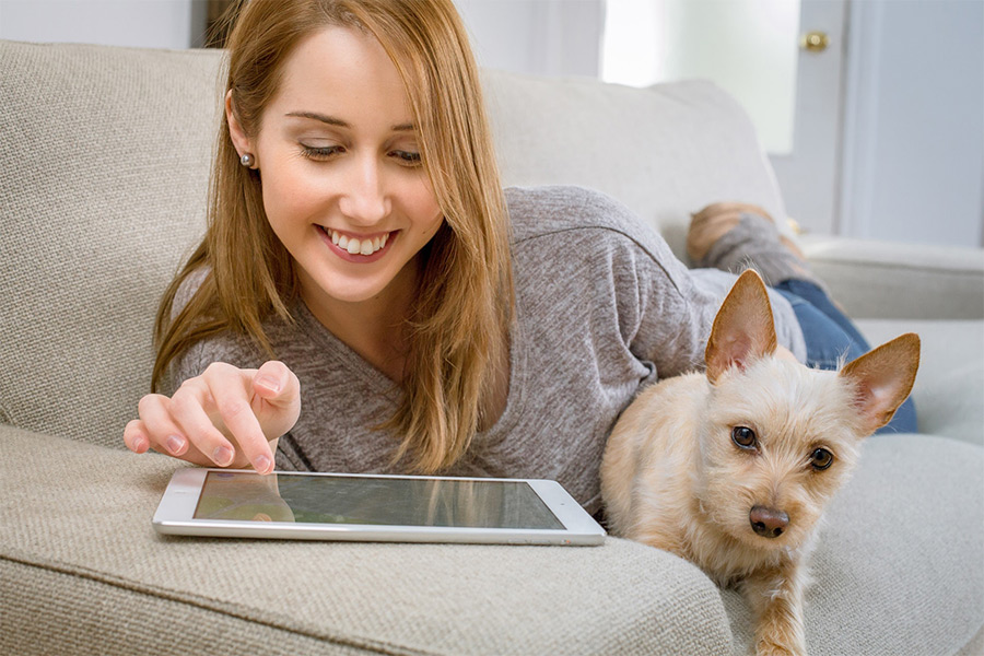 woman checking her account information on a tablet