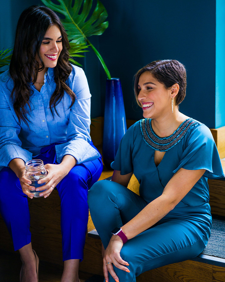 two women sitting and chatting