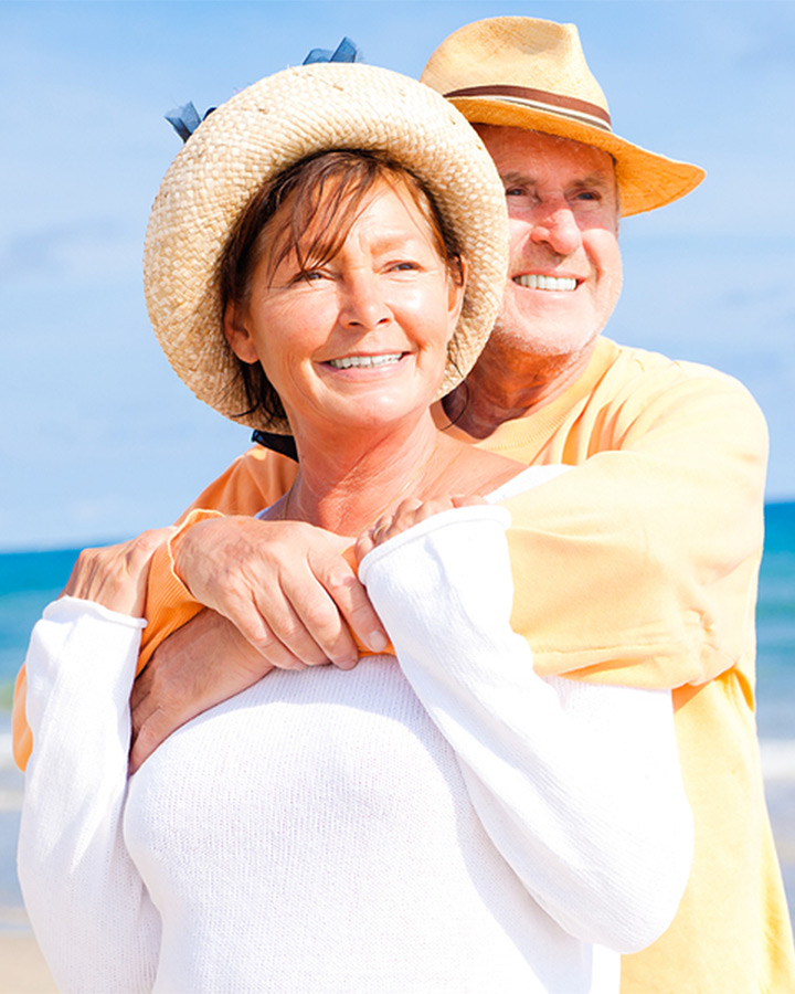 husband and wife enjoying the beach