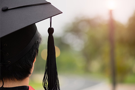 male graduate gazing into his future