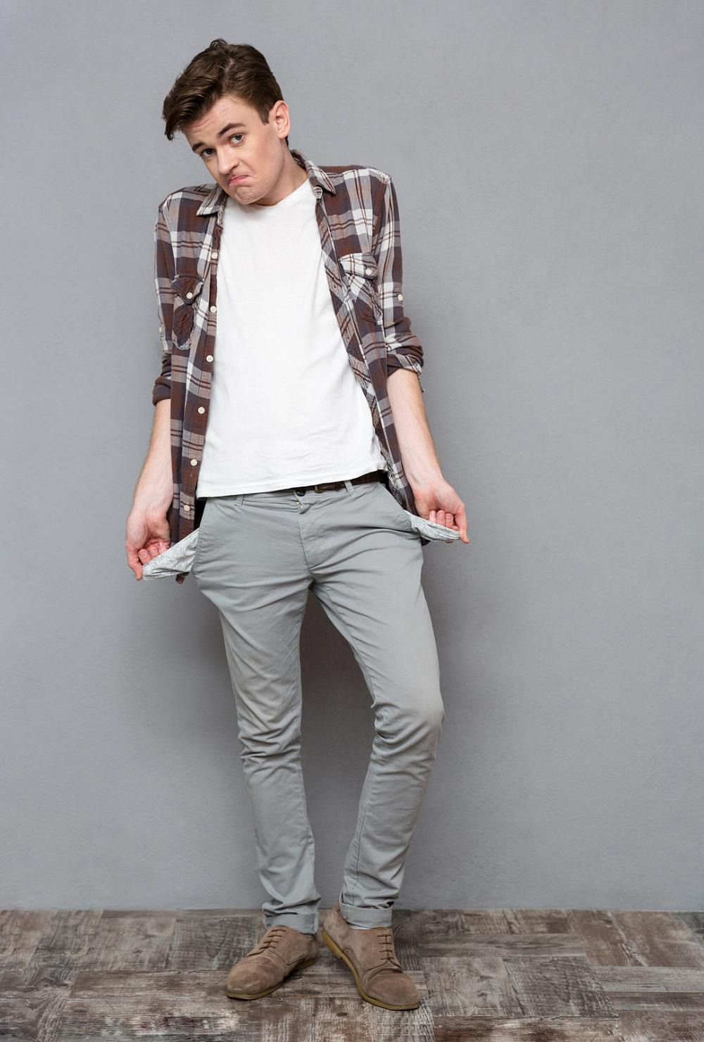 young guy with empty pockets