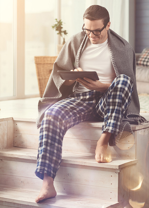 man using his tablet to review his electronic bank statements