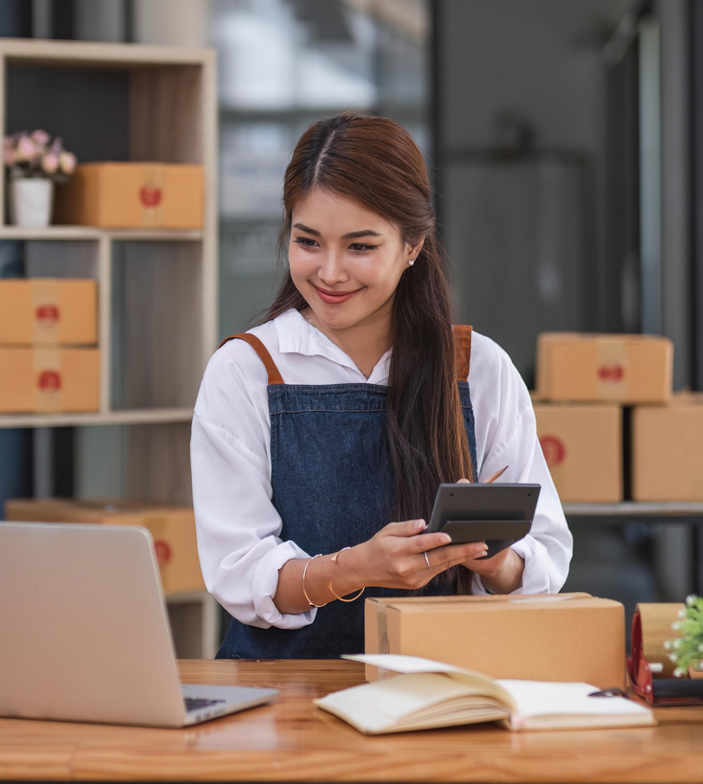 business owner using laptop to review bank account online