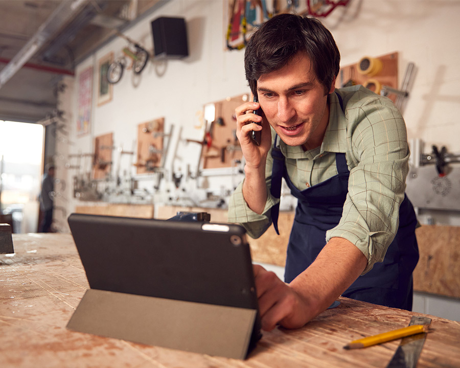 man using his tablet to check his bank account online