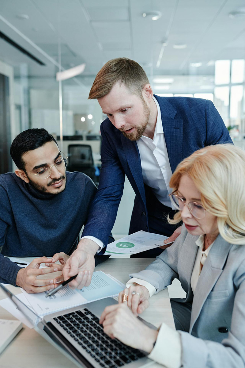 business team reviewing reports during a meeting