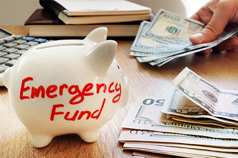 piggy bank with emergency fund written on it
