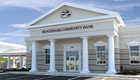 white and natural brick and concrete with white Doric columns South Boston branch location