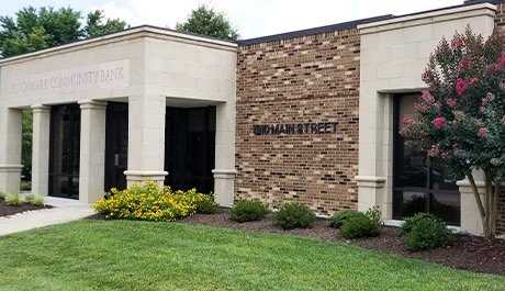 tan old brick with white concrete box column entrance Victoria branch location building