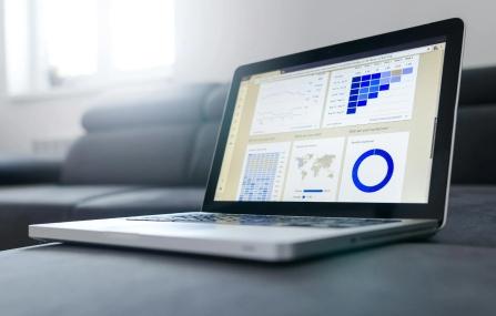laptop displaying graphs and data
